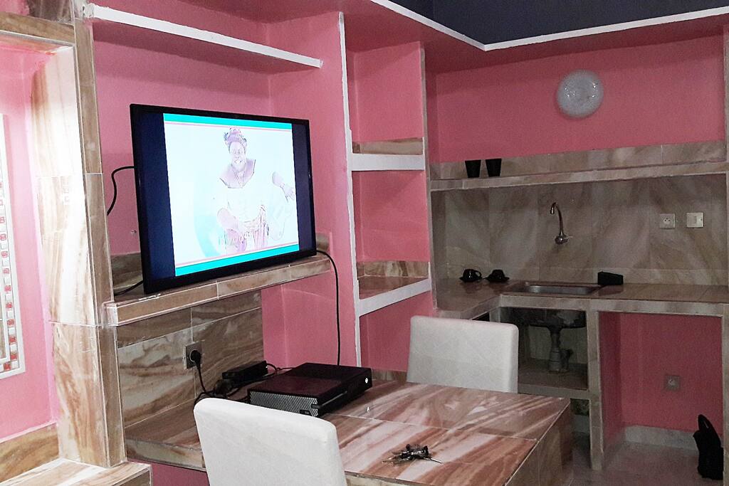 Photo of work area, Flat Screen tv, and LOTS of storage space! SenegalStyle APARTMENTS! About $50 a night or $550 a MONTH!