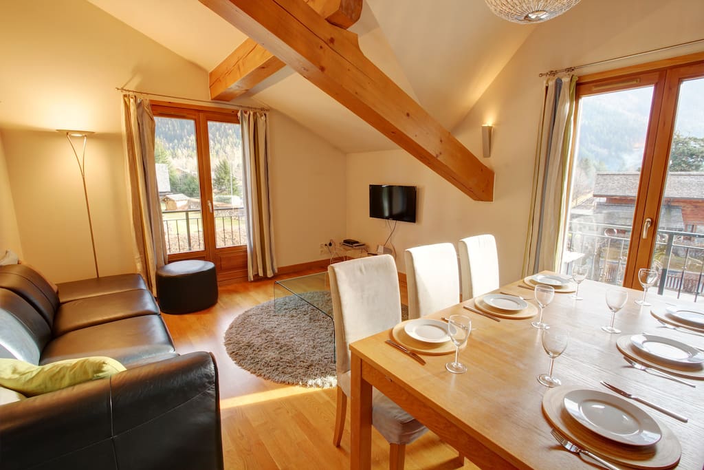 The lounge has access to the main balcony (doors on the left) and south balcony (doors on the right).