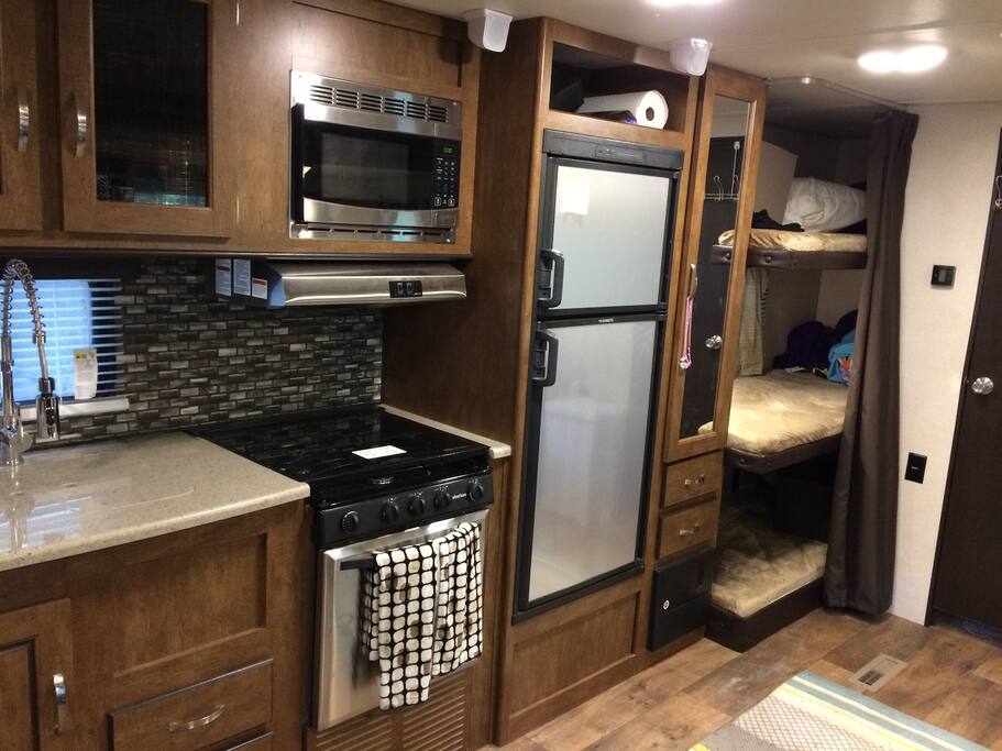 As you can see there are three single bunks in the back, we most utilize one for storage.