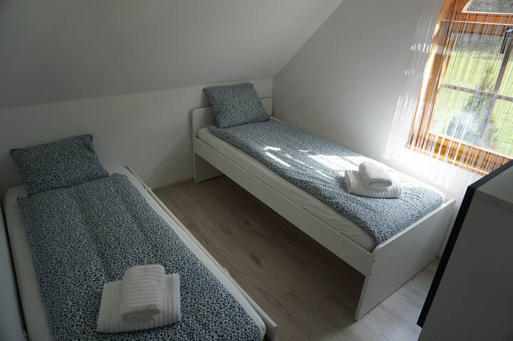 2nd bedroom with two single beds
