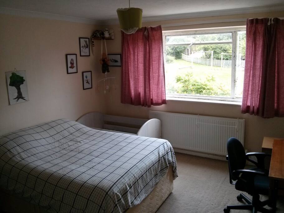 Large Bedroom with cot and nappy change station