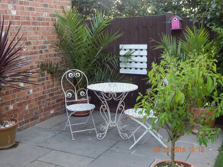 Own patio furniture, with views onto the orchard and garden.