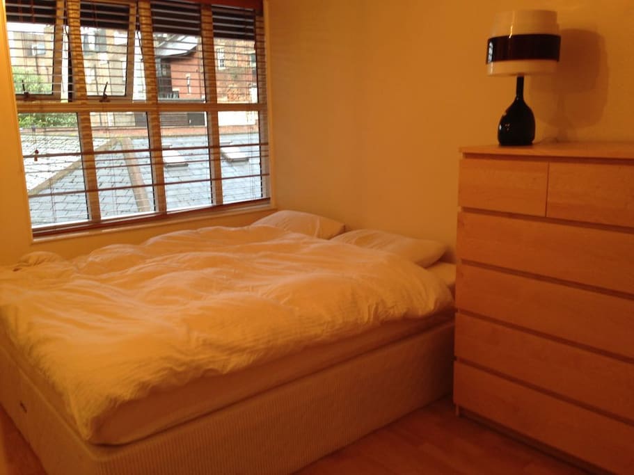 Main bedroom with Super King size bed with memory foam mattress, large built in wardrobe with plenty of space and hangers for guest clothes and chest of drawers