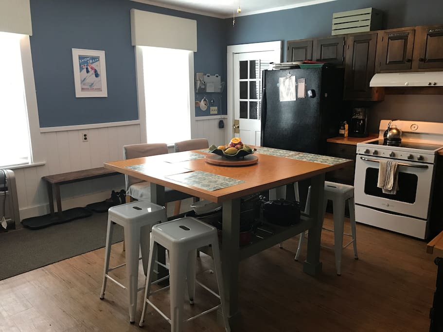Large eat in kitchen with oversized island that seats 6-8 people. Oversized refrigerator, double sink, dishwasher, new range.