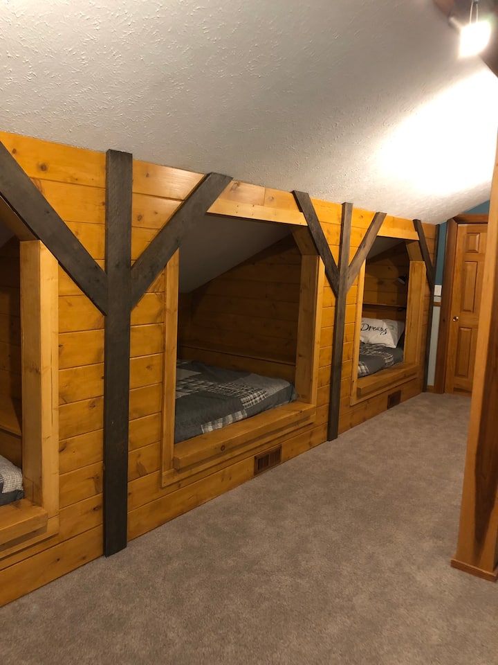 Upstairs showing 3 queen built in beds