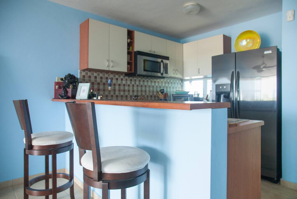 Open living Space, kitchen and large bistro style balcony.