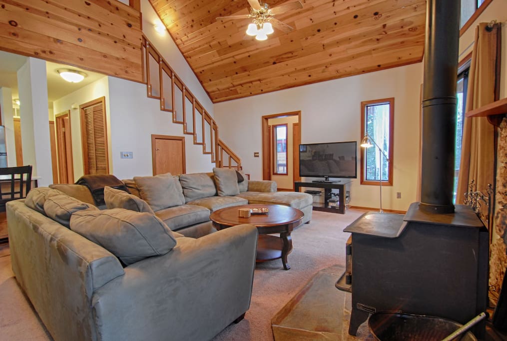 Cozy wood burning fireplace and seating area
