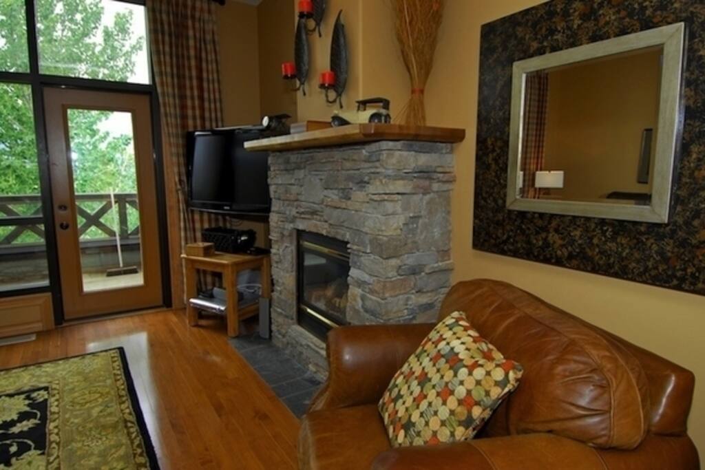 Hardwood floors and cushy furniture make this townhouse warm and inviting