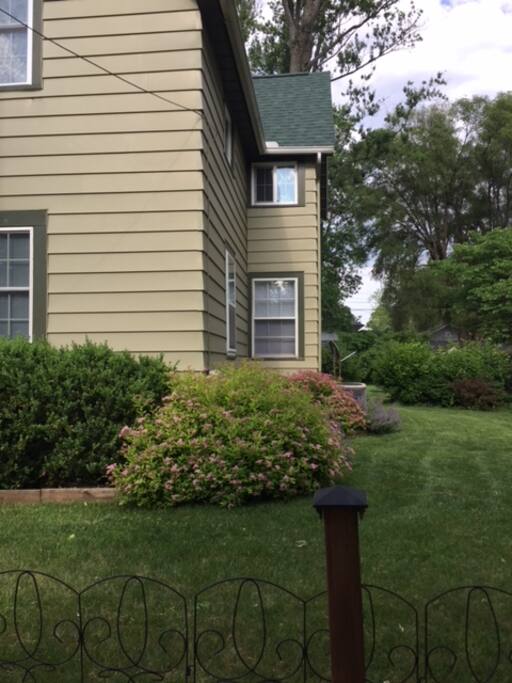 Stay in a lovely room with wooden floors, closet, two windows, and a fire pit in the backyard.