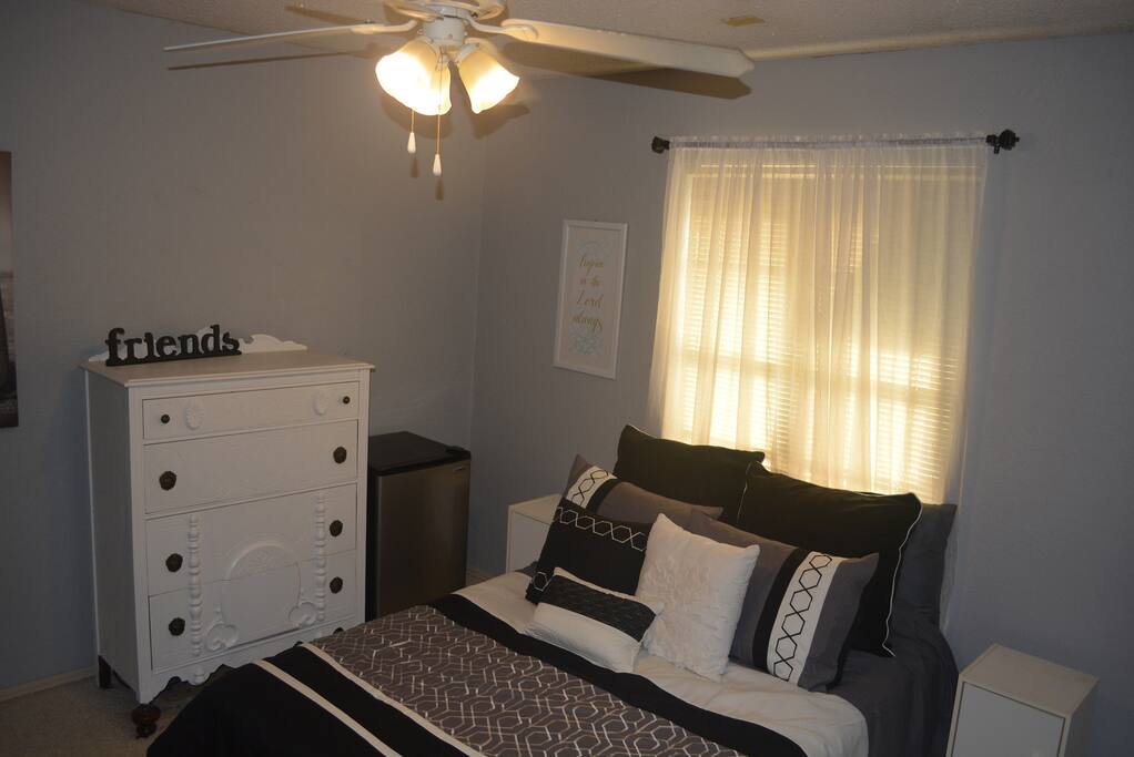 Room features a mini fridge.