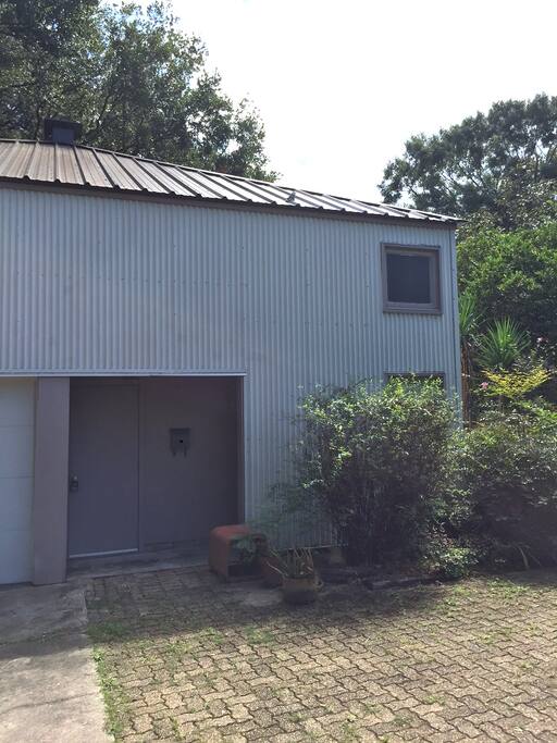 The private driveway to your own parking pad provides easy access to a secluded front entrance.