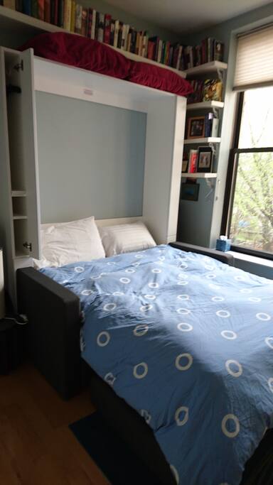 New Murphy bed with side shelves to hang a few things