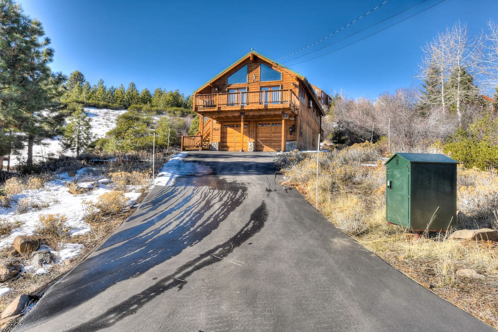 Looking up at the home from the long driveway. Bear box on the right.