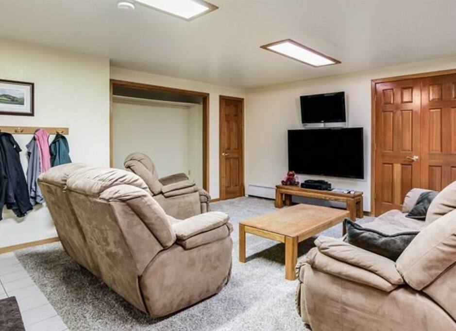 TV room all part of the downstairs 'suite'. 1 pull-out queen sofa and 1 pull-out twin love seat.