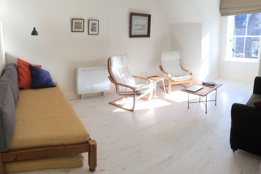Bright living room, with space for extra beds