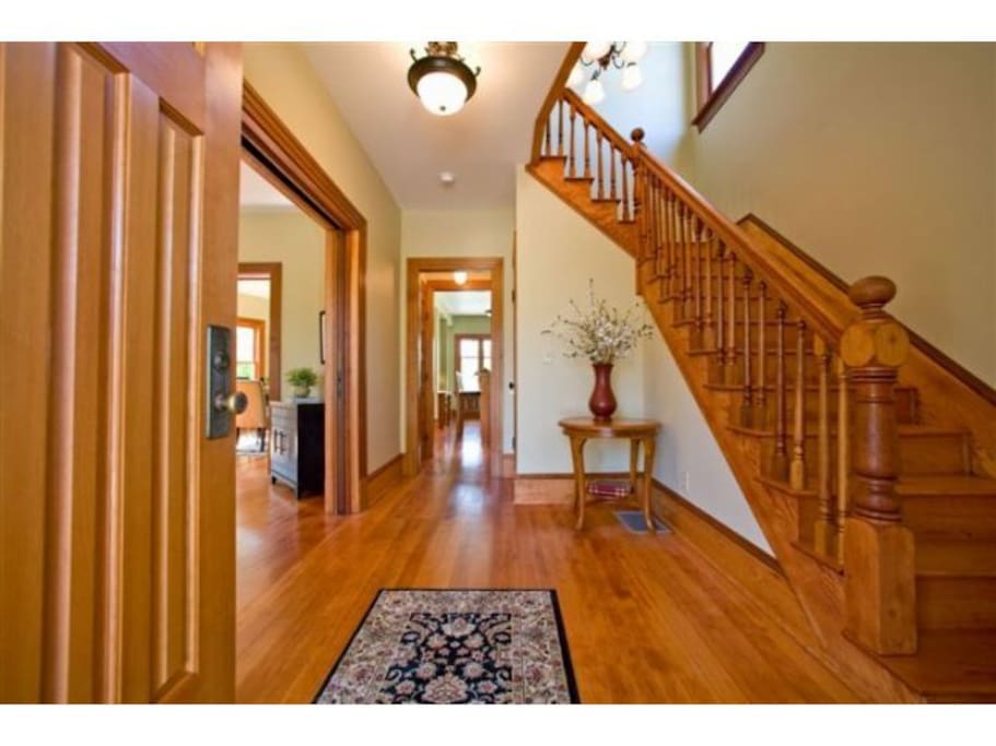 Here's our entryway as captured by a wide-angle lens (just imagine it slightly deflated). We've changed the decor a bit, but the woodwork and fixtures are the same.
