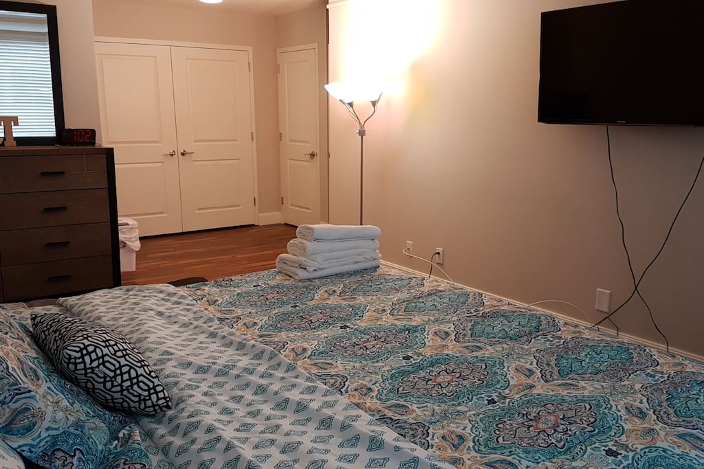 king size bed with tv and work space