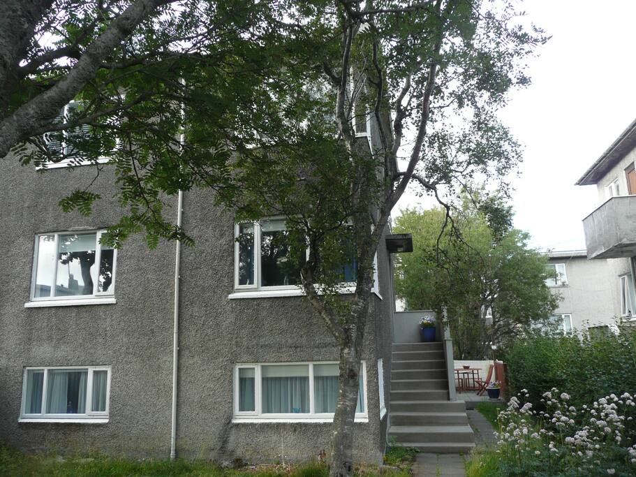 The apt. is up the stairs. garden in front