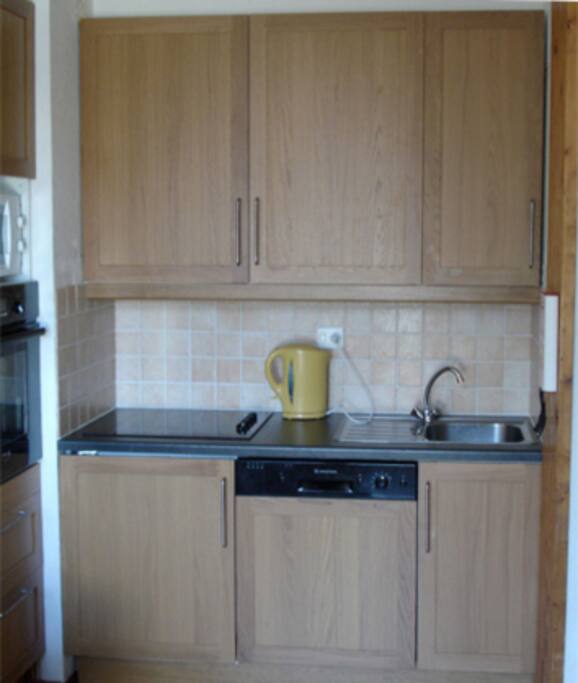 The kitchen. Built in fridge and dishwasher.