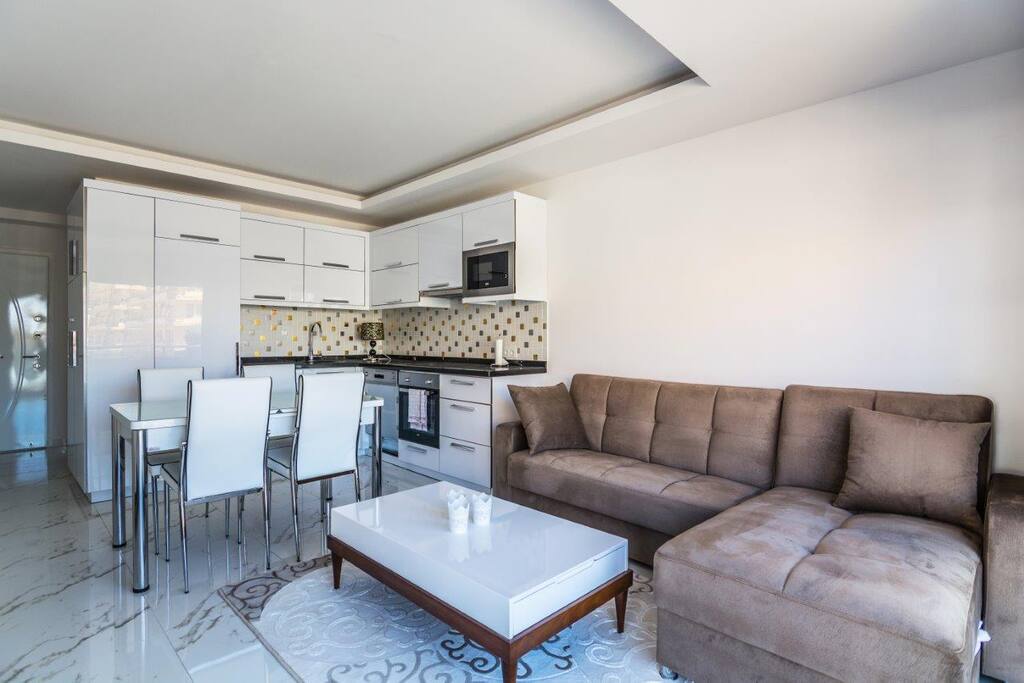 Living room with dining table and bedsofa
