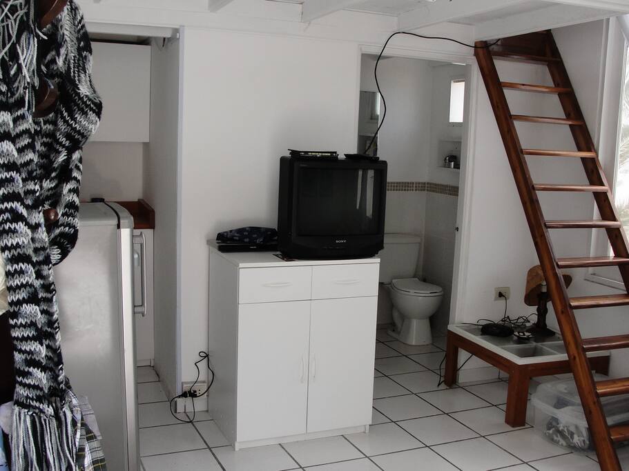 First level, kitchenet, bathroom, small living and 2 bed