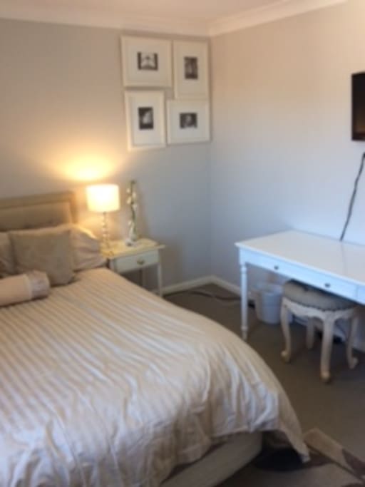 Always fresh looking room with a comfy Queen Bed, working table, TV, built-in wardrobe.
