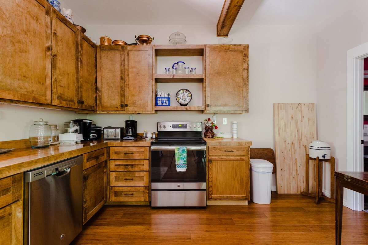 Secluded tree house apartment with high ceilings.