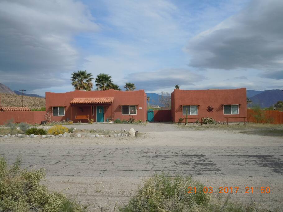 The casita is on the right, main house on the left. Enter through the gate between the two buildings.