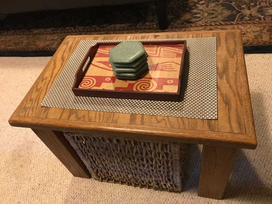 coffee table with stored blanket underneath