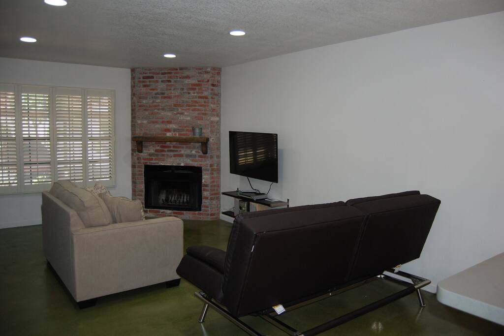 Living room with fireplace and 48" tv