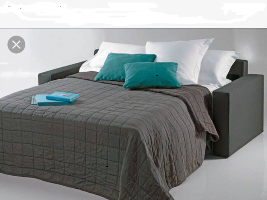 Vous pourrez dormir confortablement sur le canapé lit avec un vrai matelas