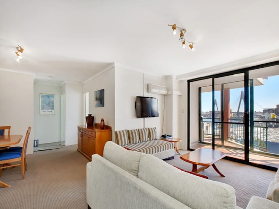 Living and dining room opens to study area and balcony