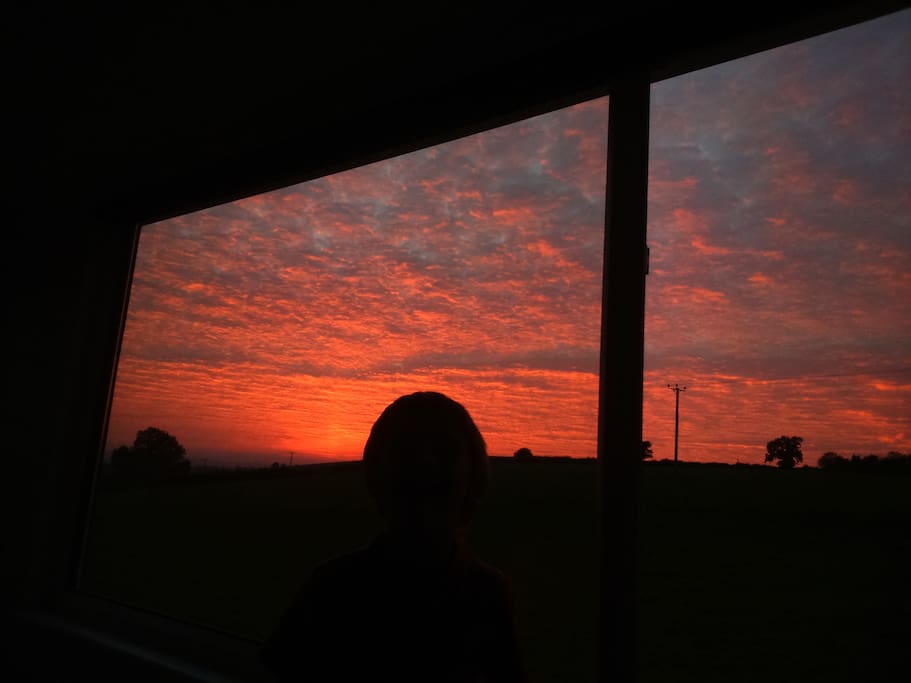 Sunset view over fields from the loft bedroom.