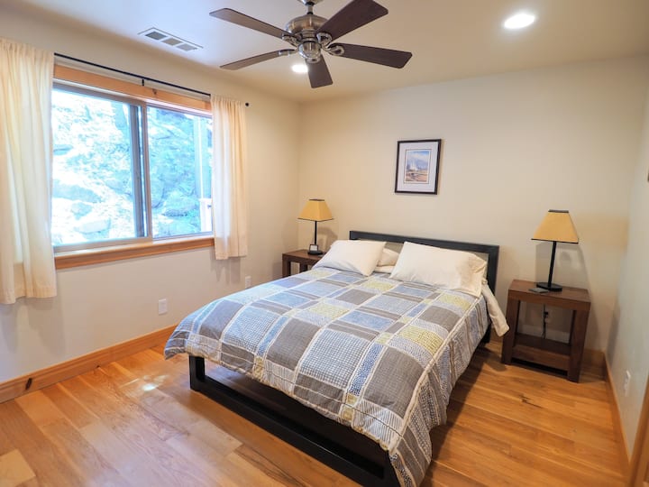 One of the guest bedrooms with a queen bed