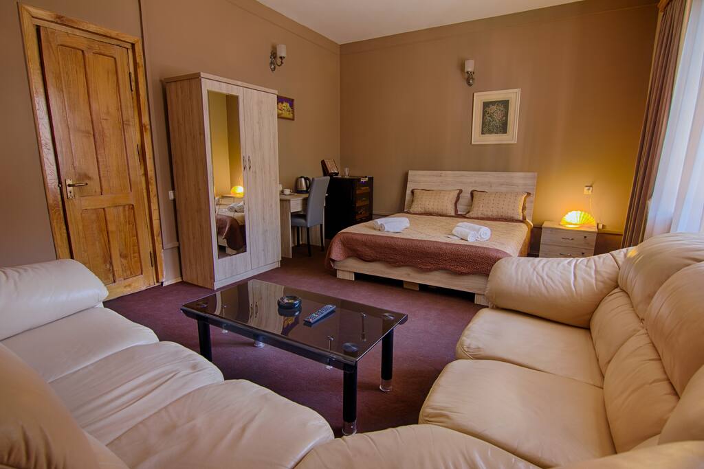 Room with king size bad and balcony