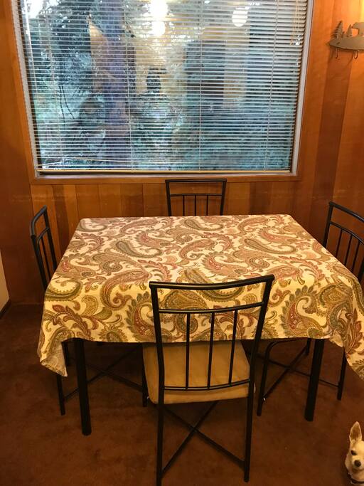 Dining area with view to the beautiful trees outside.