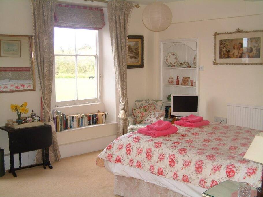 The Pink Room (£90/night). En-suite bath and with views over the lake to the rear of the house.