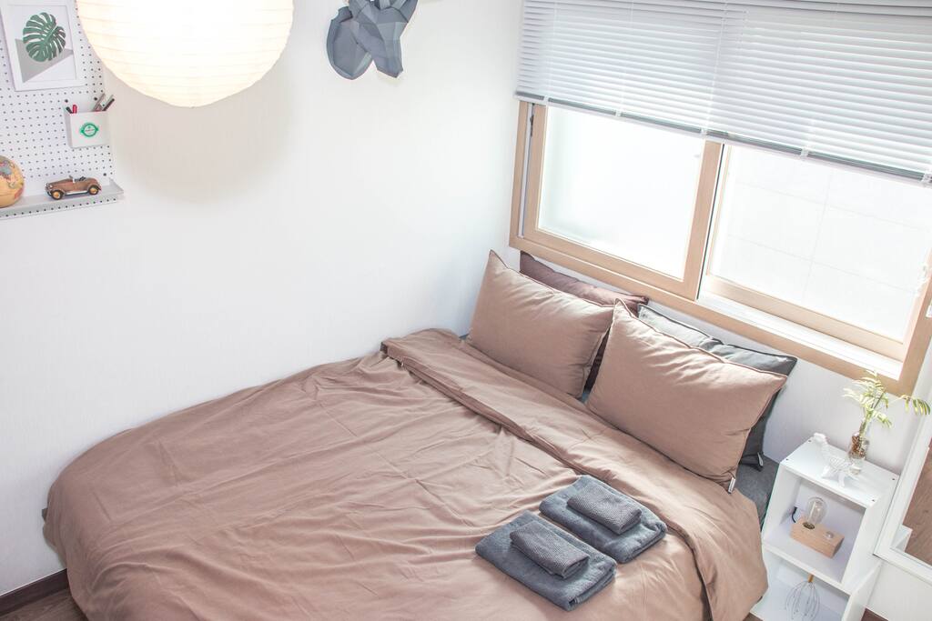 a queen size bed with a big mirror
We provide towels