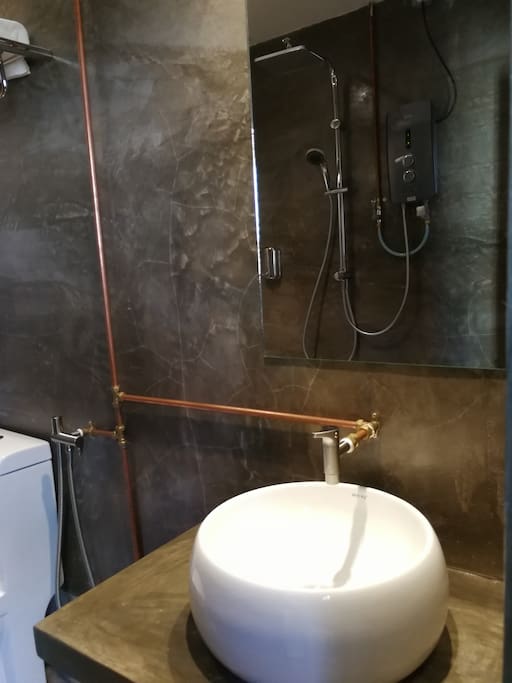 Clean and Unique toilet with hot shower