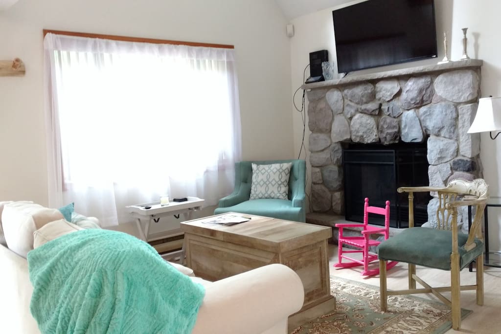Living room with wood burning fireplace