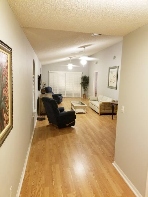 Living room with a queen pull out sofa bed.