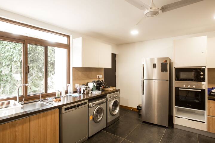 Fully Equipped (German) Kitchen with Hobb , Oven , Microwave , Dishwasher, Washing Machine Dryer, Four Stage Water Purifier.