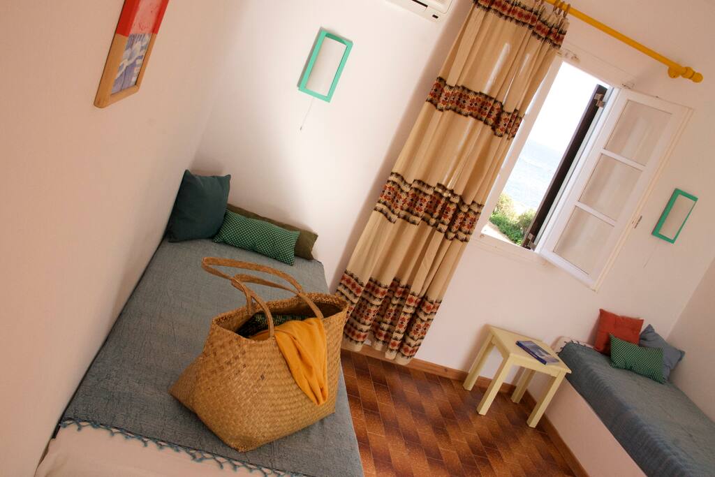 Living room area with 2 single beds