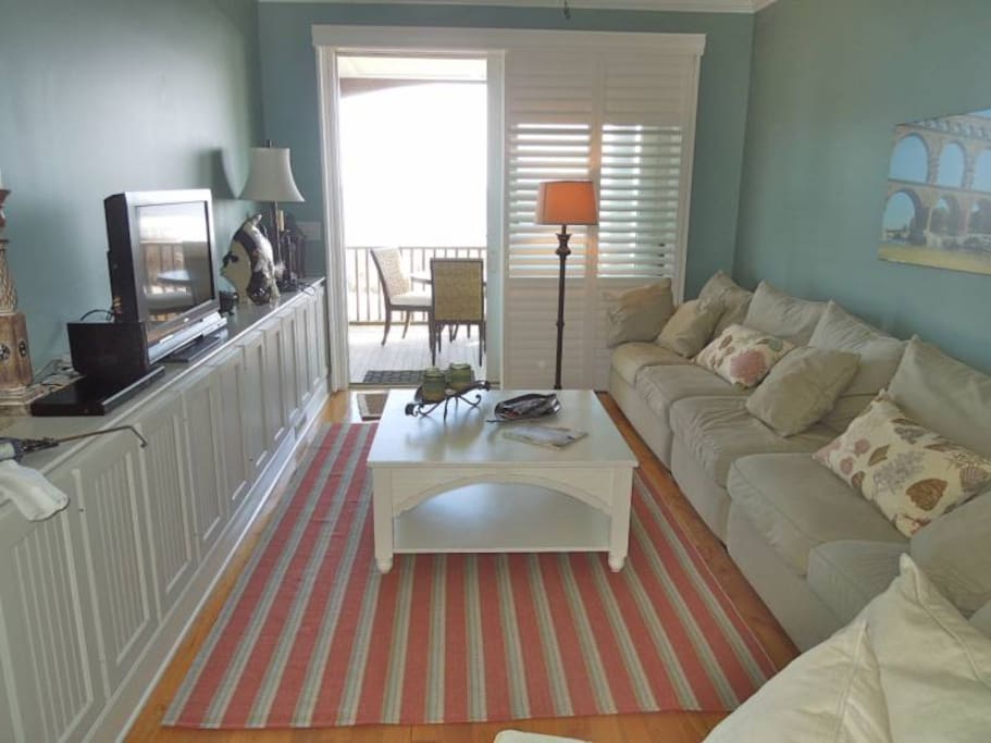 the gathering room is perfect for reading a book, visiting with family/friends, or watching television while an enjoying a beautiful view of the ocean