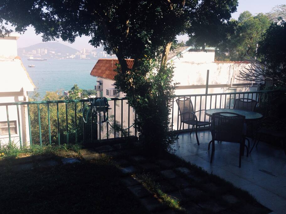 Garden with table and ocean view.