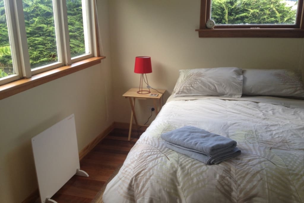 The main bedroom with wardrobe and linen provided