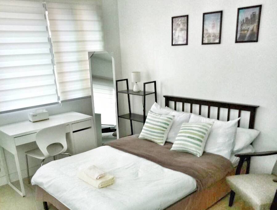 Deluxe studio room with comfy double bed and pull-out single bed