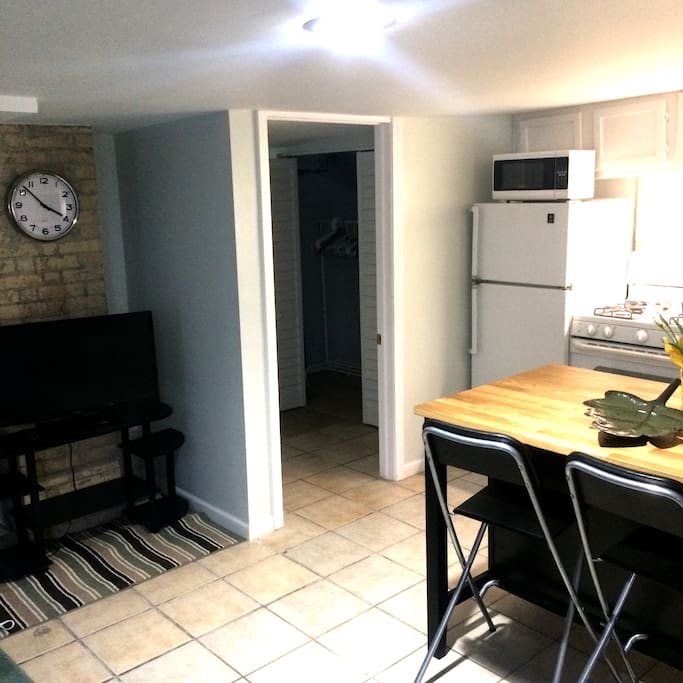 Full kitchen with stove, coffee maker, coffee, microwave, refrigerator, and toaster