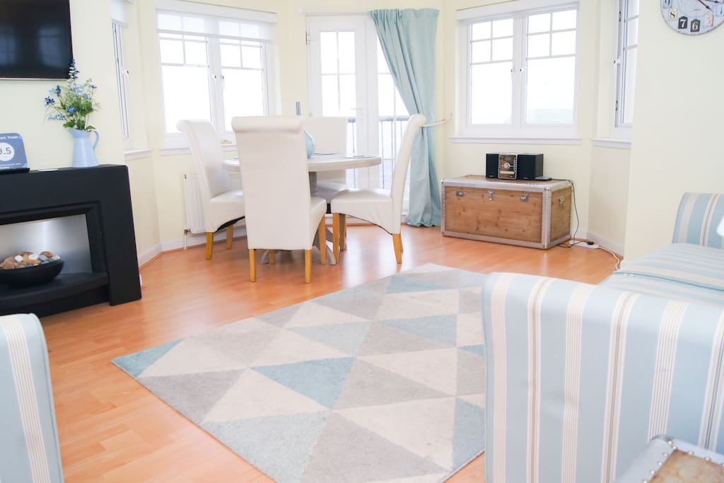 Panaromic shot of the front room which is perfect for relaxation.