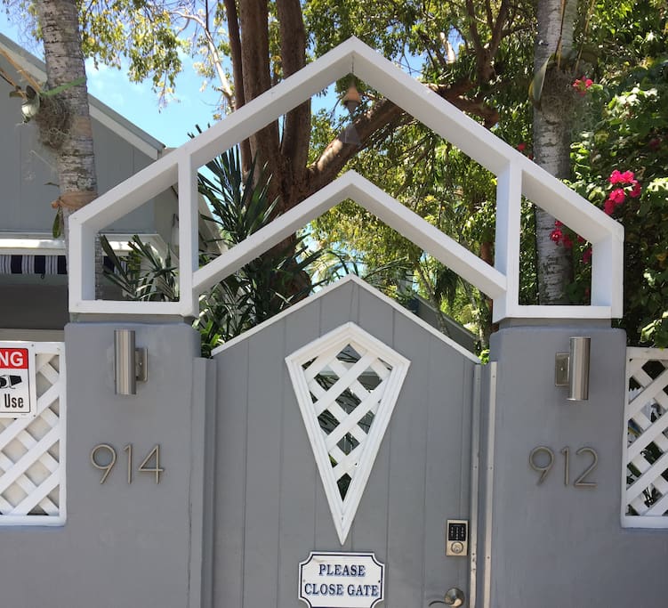 Gated compound with electronic lock. Gate to the Family House at 912-914 Center Street.
